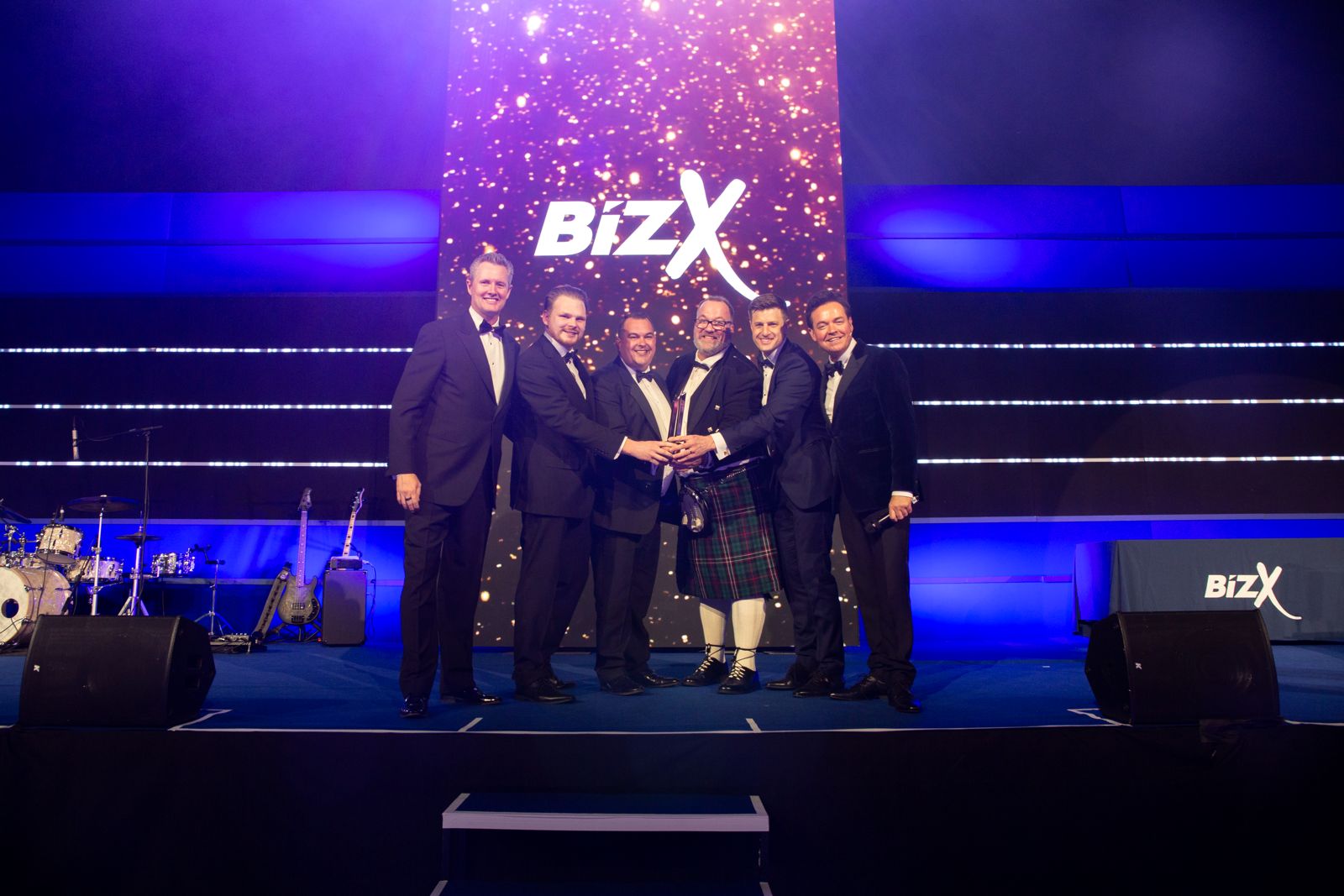 The Team receive the award at bizX for Best Overall Business