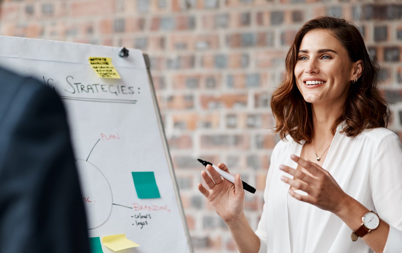 shot-of-a-young-businesswoman-presenting-notes-on-a-whiteboard-in-an-office