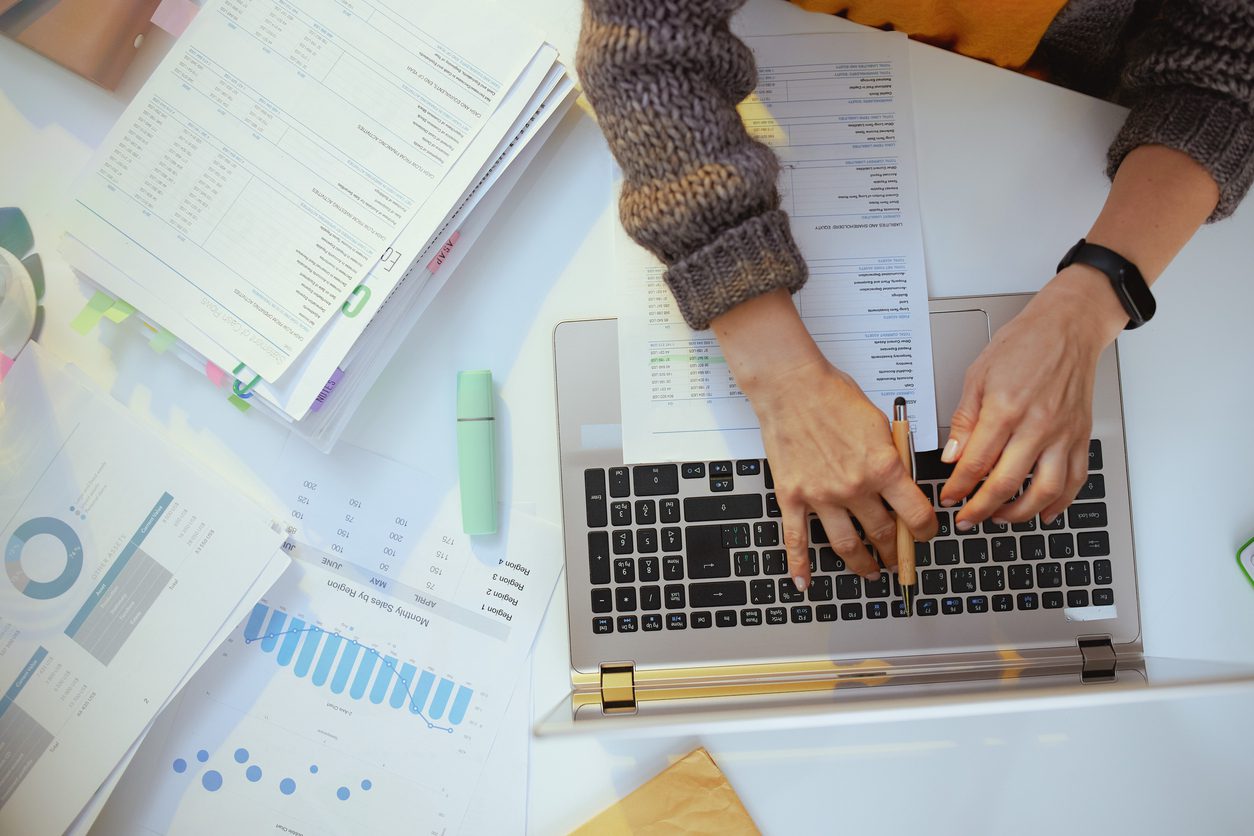 accountant-woman-with-documents-and-laptop-working