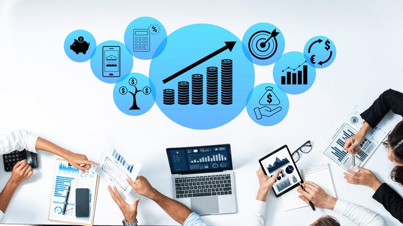 business-growth-concept-with-analytics-and-finance-elements-displayed-on-a-modern-workspace-with-diverse-professionals-analyzing-data-quark